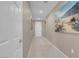 Bright hallway with tiled floors and neutral paint, perfect for showcasing artwork at 3556 Valley Lily St, North Las Vegas, NV 89032