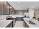 Well-equipped kitchen featuring stainless steel appliances, sleek countertops, and plentiful cabinet space at 3556 Valley Lily St, North Las Vegas, NV 89032