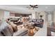Spacious living room with an open layout, seamlessly connecting the kitchen and dining areas at 3556 Valley Lily St, North Las Vegas, NV 89032