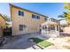 Rear exterior view of backyard with gazebo and partial view of the home's rear elevation at 3774 Dusky Flycatcher St, Las Vegas, NV 89122