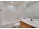 Clean bathroom with a tub and shower combo, white tiles, and a vanity sink at 3774 Dusky Flycatcher St, Las Vegas, NV 89122