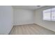 Minimalist bedroom with laminate floors and a window, perfect for a guest room or home office at 3774 Dusky Flycatcher St, Las Vegas, NV 89122