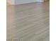 Close-up of the sleek gray wood-look flooring, adding a touch of modern elegance at 3774 Dusky Flycatcher St, Las Vegas, NV 89122