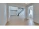 Open foyer with tile flooring featuring a staircase with wrought iron railing and double door entry at 3774 Dusky Flycatcher St, Las Vegas, NV 89122