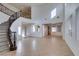 Grand foyer featuring a beautiful curved staircase and tile flooring at 3774 Dusky Flycatcher St, Las Vegas, NV 89122