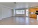 Open-concept living space features tile floors, large windows, and direct access to the outdoor living space at 3774 Dusky Flycatcher St, Las Vegas, NV 89122
