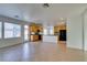Open living space with tile flooring, recessed lights, and direct access to a kitchen with stainless appliances at 3774 Dusky Flycatcher St, Las Vegas, NV 89122