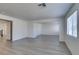Spacious living room with tile floors and ample natural light from the large window at 3774 Dusky Flycatcher St, Las Vegas, NV 89122