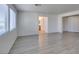 Open living room with tile floors, natural light, and a glimpse of an adjoining bathroom at 3774 Dusky Flycatcher St, Las Vegas, NV 89122