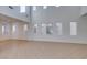 Bright and airy living room with tile flooring and multiple large windows at 3774 Dusky Flycatcher St, Las Vegas, NV 89122