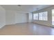 Open living area with tile floors, recessed lighting, and sliding glass door access to the outdoor space at 3774 Dusky Flycatcher St, Las Vegas, NV 89122