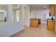 Open-concept kitchen to living space with white walls at 3774 Dusky Flycatcher St, Las Vegas, NV 89122