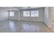 Open living room featuring tile floors, neutral paint and large windows offering natural light at 3774 Dusky Flycatcher St, Las Vegas, NV 89122