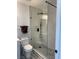 Bathroom featuring a tiled shower with a glass door and a sleek black shower head at 3831 Atlantis St, Las Vegas, NV 89121