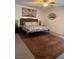 Bedroom featuring a bed with decorative pillows, side tables, and art that creates a cozy atmosphere at 3831 Atlantis St, Las Vegas, NV 89121