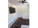 Bedroom with ceiling fan, TV, rug and two mattresses at 3831 Atlantis St, Las Vegas, NV 89121