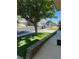 Front yard featuring desert landscaping, shade tree, and a view of the neighborhood street at 3831 Atlantis St, Las Vegas, NV 89121