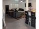 Bright living room featuring contemporary furnishings, open floor plan, ceiling fan, and tile floors at 3831 Atlantis St, Las Vegas, NV 89121