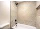 A stylish bathroom featuring unique tiled shower with modern fixtures and a bathtub at 4450 San Rafael Ave, Las Vegas, NV 89120