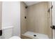 Bathroom featuring a modern shower with wood-like tile and black shower fixtures at 4450 San Rafael Ave, Las Vegas, NV 89120