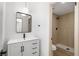 Modern bathroom with stylish vanity and walk-in shower featuring wood-like tiles at 4450 San Rafael Ave, Las Vegas, NV 89120