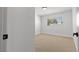 Bedroom with carpeting and a window overlooking trees at 4450 San Rafael Ave, Las Vegas, NV 89120