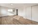 Bedroom with wood-look floors and sliding closet doors at 4450 San Rafael Ave, Las Vegas, NV 89120