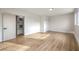 Spacious bedroom with light wood-look floors, white walls, and ample closet space at 4450 San Rafael Ave, Las Vegas, NV 89120