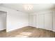 Bedroom with light wood-look floors and closet with sliding doors at 4450 San Rafael Ave, Las Vegas, NV 89120