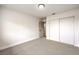 This bright bedroom features carpet flooring and a convenient sliding door closet at 4450 San Rafael Ave, Las Vegas, NV 89120