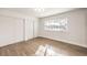 Bedroom with wood-look floors and closet with sliding doors at 4450 San Rafael Ave, Las Vegas, NV 89120