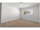 Bright bedroom featuring carpeted floors and a sun-filled window at 4450 San Rafael Ave, Las Vegas, NV 89120