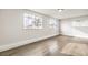 Bedroom with light wood-look floors and windows at 4450 San Rafael Ave, Las Vegas, NV 89120