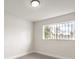 Bright room with modern light fixture and window with bars for security at 4450 San Rafael Ave, Las Vegas, NV 89120
