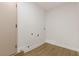 This laundry room features wood look floors and essential hookups at 4450 San Rafael Ave, Las Vegas, NV 89120