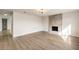 Spacious living room features light-wood flooring, modern fireplace, and contemporary lighting at 4450 San Rafael Ave, Las Vegas, NV 89120