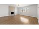 Bright living room with a modern fireplace, hardwood floors, and ample natural light at 4450 San Rafael Ave, Las Vegas, NV 89120