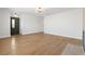 Spacious living room with hardwood floors, modern lighting, and a green entry door at 4450 San Rafael Ave, Las Vegas, NV 89120