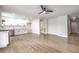 Open-concept living area with light-wood floors seamlessly connects the living room and kitchen at 4450 San Rafael Ave, Las Vegas, NV 89120