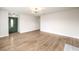 Spacious living room featuring light-wood floors, modern lighting and neutral paint colors at 4450 San Rafael Ave, Las Vegas, NV 89120