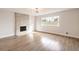 Living room showcasing light-wood floors, modern fireplace and contemporary lighting at 4450 San Rafael Ave, Las Vegas, NV 89120
