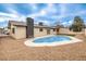 Backyard showcasing pool, rock landscaping and a partial view of home's exterior at 4450 San Rafael Ave, Las Vegas, NV 89120