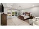 Cozy main bedroom with a queen-sized bed and access to a private outdoor patio at 4505 Amazing View St, Las Vegas, NV 89129