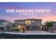 Beautiful two-story home with manicured landscaping and a three-car garage in a desirable neighborhood at 4505 Amazing View St, Las Vegas, NV 89129