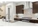 Close-up of a modern kitchen with stainless steel appliances, gas cooktop, and an undermount sink at 4505 Amazing View St, Las Vegas, NV 89129