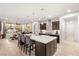 Open kitchen featuring a large island with seating, modern appliances, and ample natural light at 4505 Amazing View St, Las Vegas, NV 89129