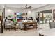 Elegant living room with comfortable seating, media center, fireplace, and view of the outdoor kitchen at 4505 Amazing View St, Las Vegas, NV 89129