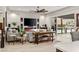 Bright living room with a modern fireplace, large TV, comfortable seating, and outdoor access to a kitchen at 4505 Amazing View St, Las Vegas, NV 89129