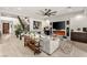 Inviting living room with a staircase, fireplace, entertainment center, and stylish decor at 4505 Amazing View St, Las Vegas, NV 89129
