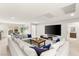 Comfortable loft featuring a large sectional sofa, TV, and access to the outdoor patio at 4505 Amazing View St, Las Vegas, NV 89129